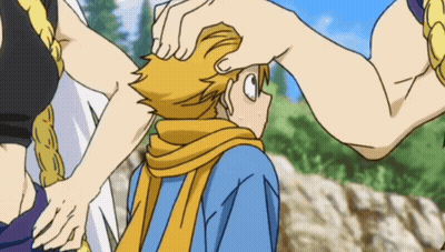 A Person Petting Another Person 'S Head With A Yellow Scarf GIF
