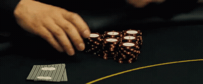 A Person Playing Poker With A Stack Of Chips That Have The Letter I On Them GIF