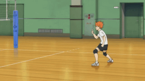 A Person Playing Volleyball In A Gym With A Sign On The Wall That Says Fire GIF