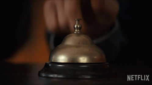 A Person Pressing A Bell With Netflix Written On The Bottom GIF