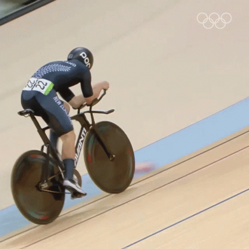 A Person Riding A Bicycle With The Number 22 On Their Back GIF