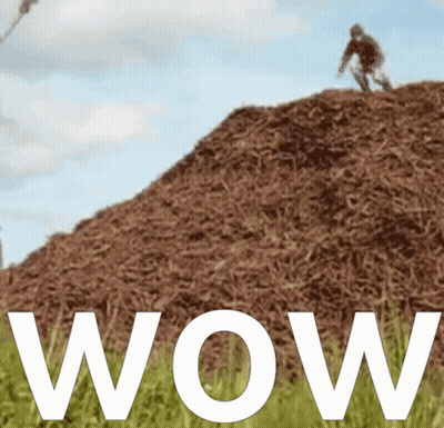 A Person Riding A Bike On Top Of A Pile Of Hay GIF
