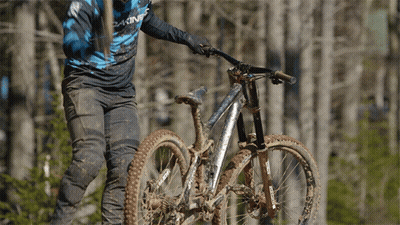 A Person Riding A Bike With A Shirt That Says Dakine GIF