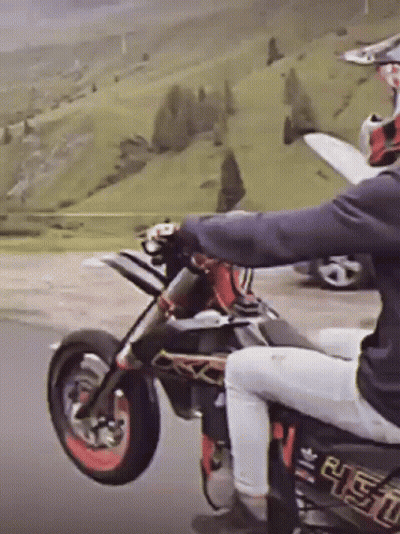 A Person Riding A Dirt Bike With A Sticker On The Back That Says ' R.e.t.o. ' GIF