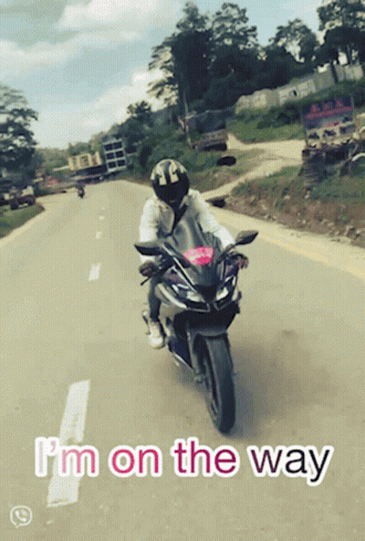 A Person Riding A Motorcycle With The Words I 'M On The Way GIF
