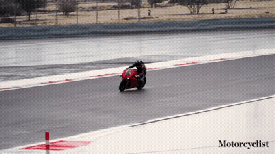 A Person Riding A Red Motorcycle On A Track With The Words Motorcyclist Below Them GIF