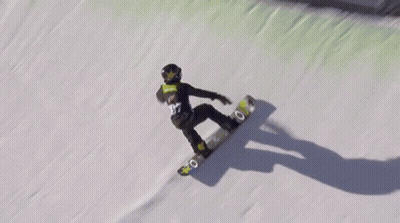 A Person Riding A Snowboard Down A Snowy Hill GIF