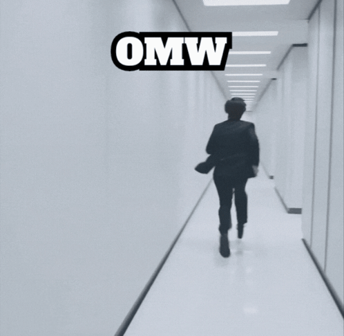 A Person Running Down A Hallway With The Word Omw On The Top GIF