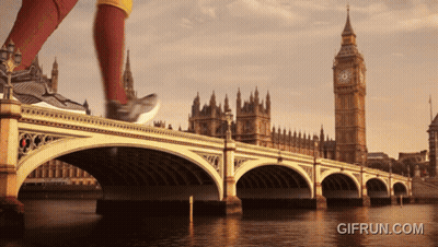 A Person Running On A Bridge With A Big Ben In The Background GIF