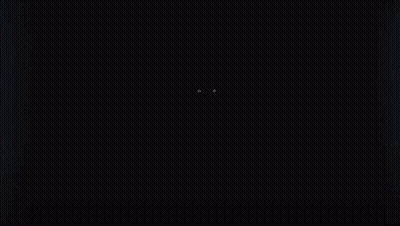 a person 's eyes are glowing in the dark in a dark room .