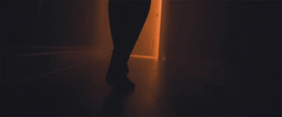 A Person 'S Feet Are Shown Walking Through A Doorway GIF