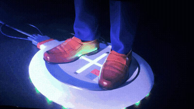 A Person 'S Feet Are Standing On A Circle That Has A Cross On It GIF