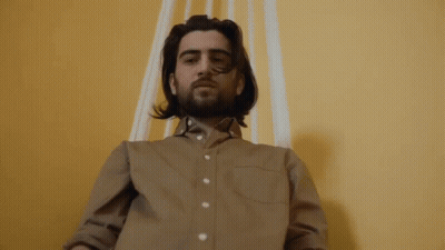 A Person 'S Feet Are Standing On A Wet Floor GIF