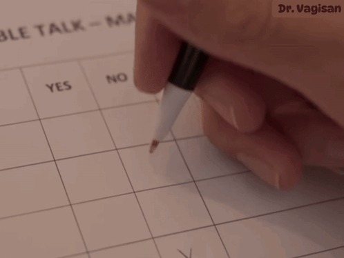 A Person 'S Hand Is Holding A Pen Over A Calendar That Says Yes GIF