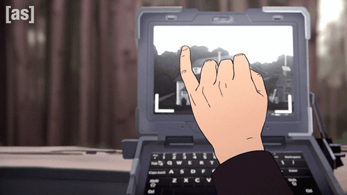 A Person 'S Hand Is Pointing At A Laptop Screen With The Letter L On It GIF