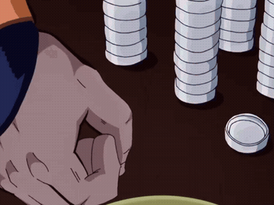 A Person 'S Hand Is Reaching For Something On A Table With Stacks Of Coins In The Background GIF