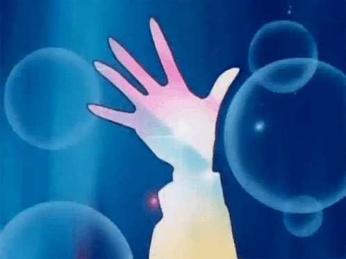 A Person 'S Hand Is Reaching Out Towards A Bubble In The Water . GIF