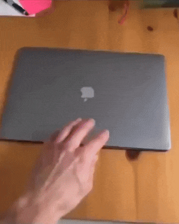 A Person 'S Hand Is Resting On An Apple Laptop GIF