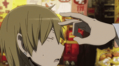 A Person 'S Hand Is Touching Another Person 'S Forehead In Front Of A Sign That Says Mcdonalds GIF