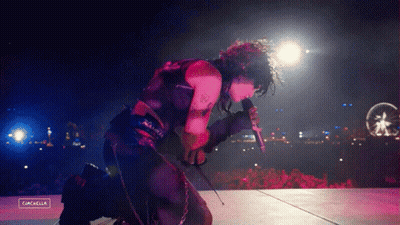 A Person Singing Into A Microphone With The Word Cancella On The Bottom GIF