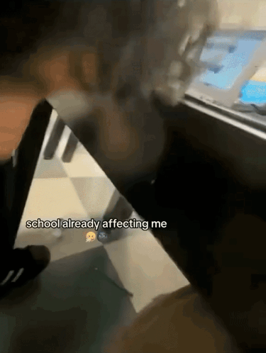 A Person Sitting At A Desk With The Words " School Already Affecting Me " On The Bottom GIF