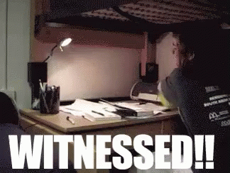 A Person Sitting At A Desk With The Words Witnessed Written On It GIF