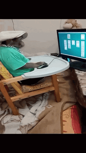 A Person Sitting In A High Chair Playing A Computer Game GIF