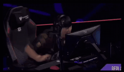 A Person Sitting In Front Of A Computer With A Shirt That Says ' Gen ' On It GIF