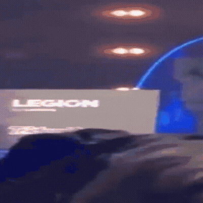 A Person Sitting In Front Of A Legion Sign GIF