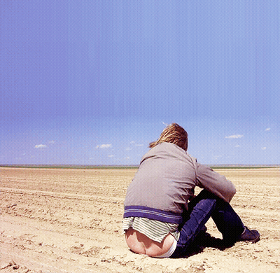 A Person Sitting In The Dirt With Their Butt Showing GIF