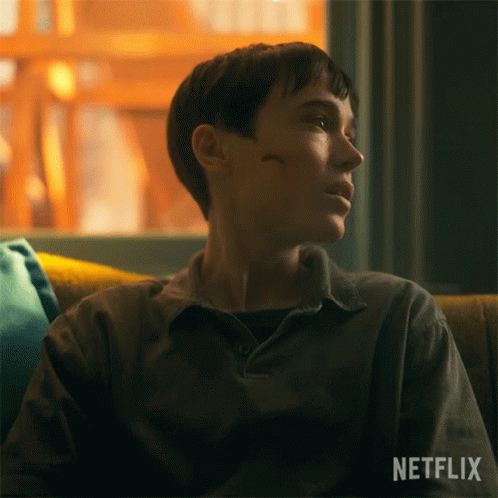 A Person Sitting On A Couch With A Netflix Logo On The Bottom Right GIF