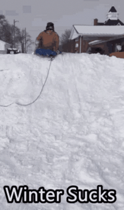 A Person Sledding Down A Snowy Hill With The Words Winter Sucks Written Below Them GIF