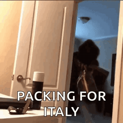 A Person Standing In A Doorway With The Words " Packing For Italy " On The Bottom GIF