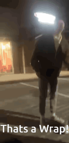 A Person Standing In A Parking Lot With The Words Thats A Wrap GIF