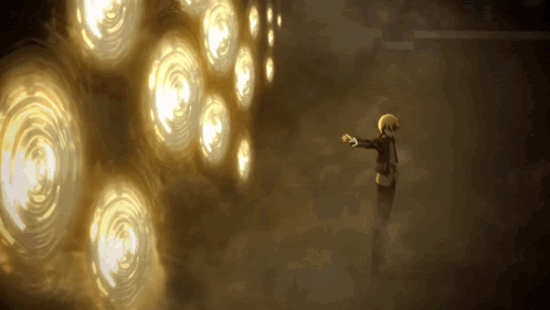 A Person Standing In Front Of A Wall With Circles Of Light On It GIF
