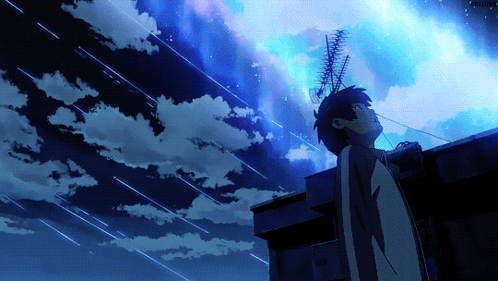 A Person Standing On A Roof Looking Up At A Starry Sky GIF