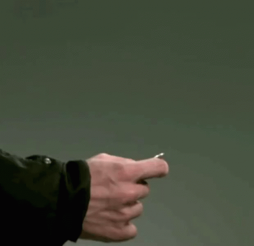 A Person Throwing A Coin In The Air GIF