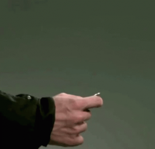 A Person Throwing A Coin In The Air GIF