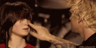 A Person Touching Another Person 'S Nose With A Tattoo On Their Arm That Says Cookie-Monster123 GIF
