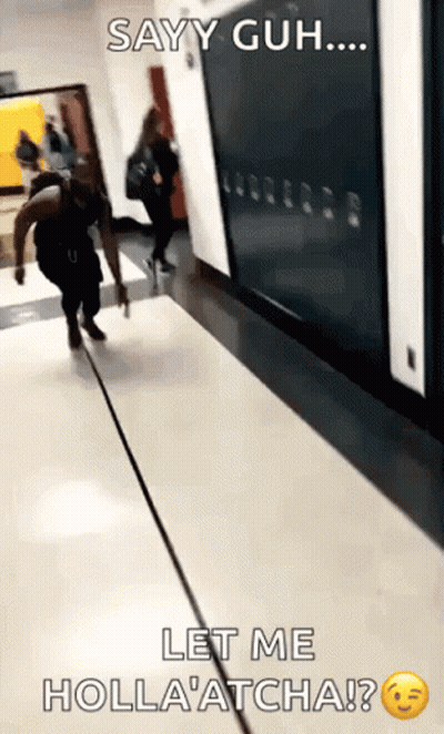 A Person Walking Down A Hallway With The Caption Sayy Guh Let Me Holla Atcha ? GIF