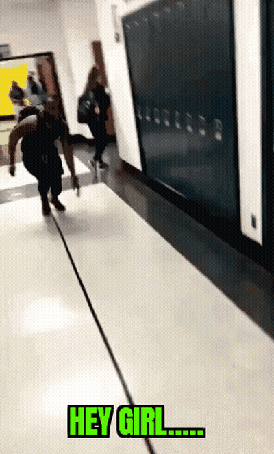 A Person Walking Down A Hallway With The Words " Hey Girl " On The Floor GIF