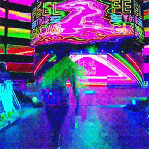 A Person Walking In Front Of A Neon Sign That Says " Feel The Glow " GIF