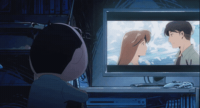 A Person Watching A Cartoon On A Computer Monitor GIF