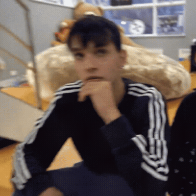 A Person Wearing A Black And White Adidas Sweatshirt GIF