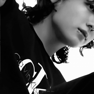 A Person Wearing A Black Calvin Klein Shirt GIF