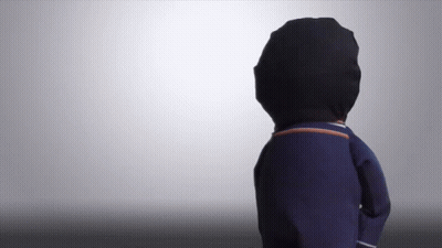 A Person Wearing A Black Hat And A Blue Sweater GIF