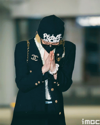 A Person Wearing A Black Hat That Says Peace GIF