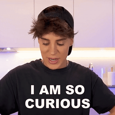 A Person Wearing A Black Shirt That Says " I Am So Curious " GIF