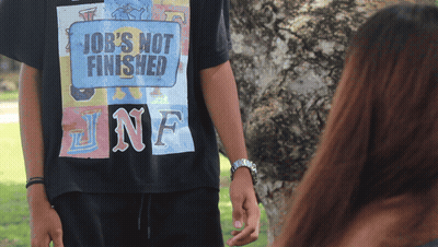 A Person Wearing A Black Shirt That Says Job 'S Not Finished GIF