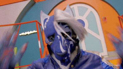 A Person Wearing A Blue And White Mask With The Letter R On It GIF
